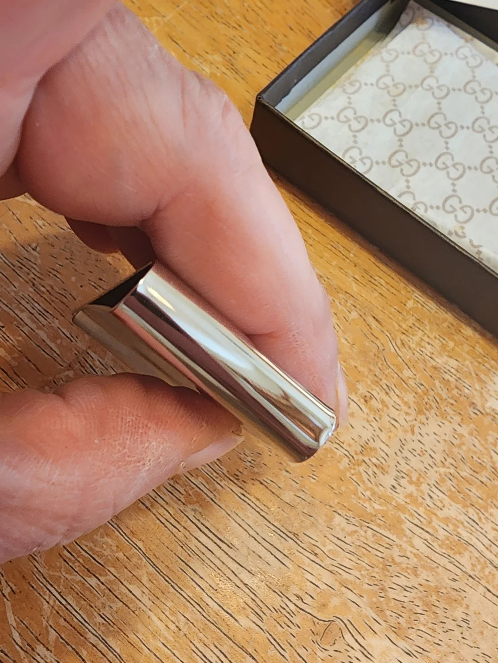 Gucci Diamante money clip featuring the signature diamond pattern and engraved